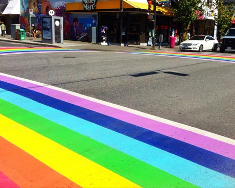 People walking on the Rainbow Crosswalk